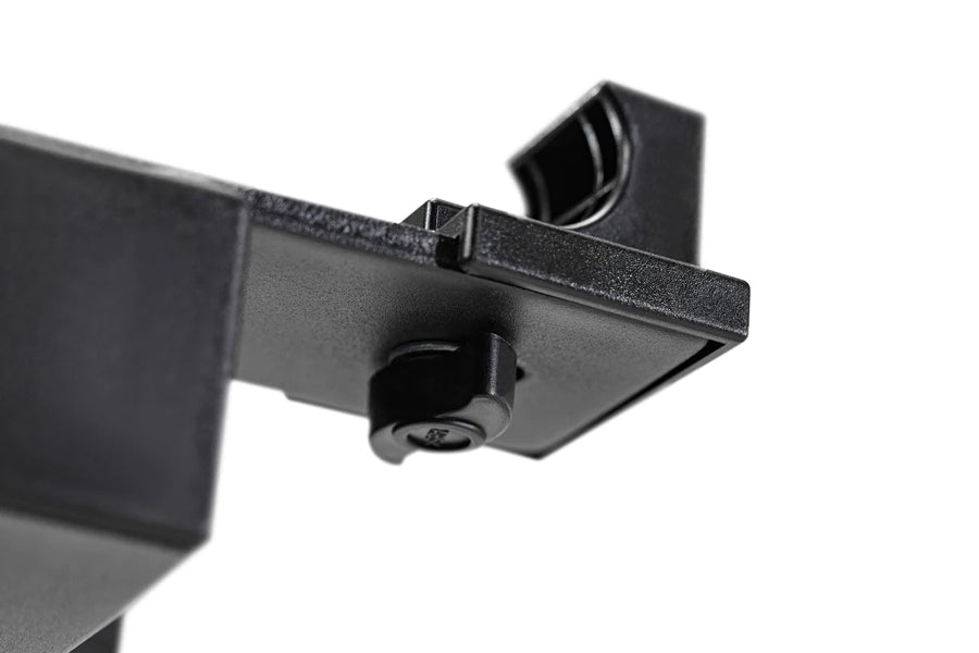 Black metal dumbbell stand with double legs and adjustable mounting bracket on white background