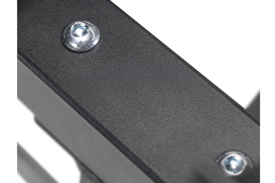 Black metal dumbbell stand with textured finish and chrome hardware detail, close-up view