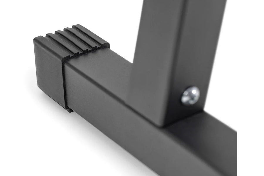 Black adjustable dumbbell stand with double legs and ridged grip pads, shown on white background
