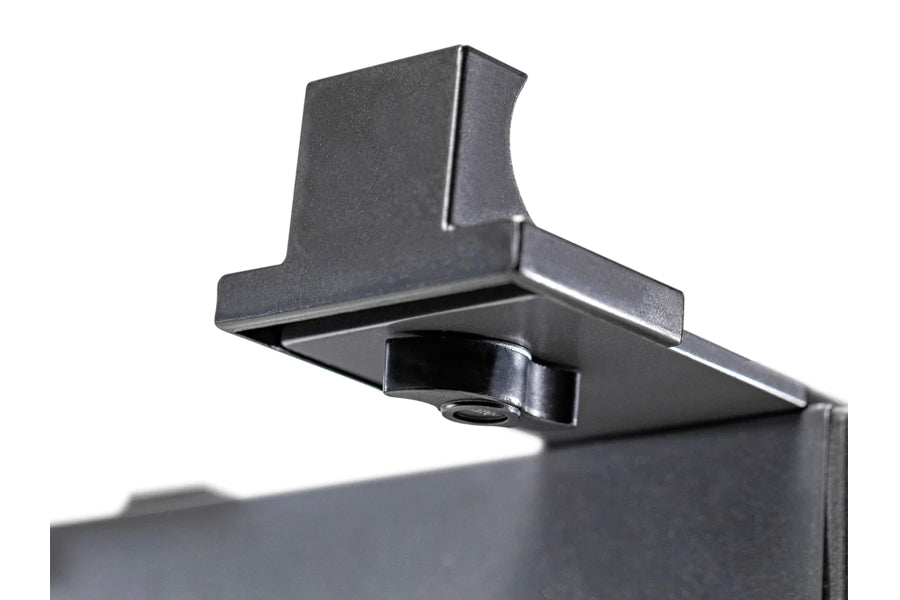 Black steel dumbbell stand with single leg support and adjustable upper bracket on white background