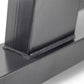 Charcoal gray steel dumbbell stand with single leg, close-up detail view showing base and support structure