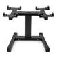 Black dumbbell stand with adjustable arms and single center leg on white background
