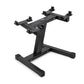 Black adjustable dumbbell stand with single-legged base and multiple mounting brackets on horizontal bar, on white background