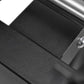 Black adjustable dumbbell stand with single leg support, shown from angled overhead view on white background