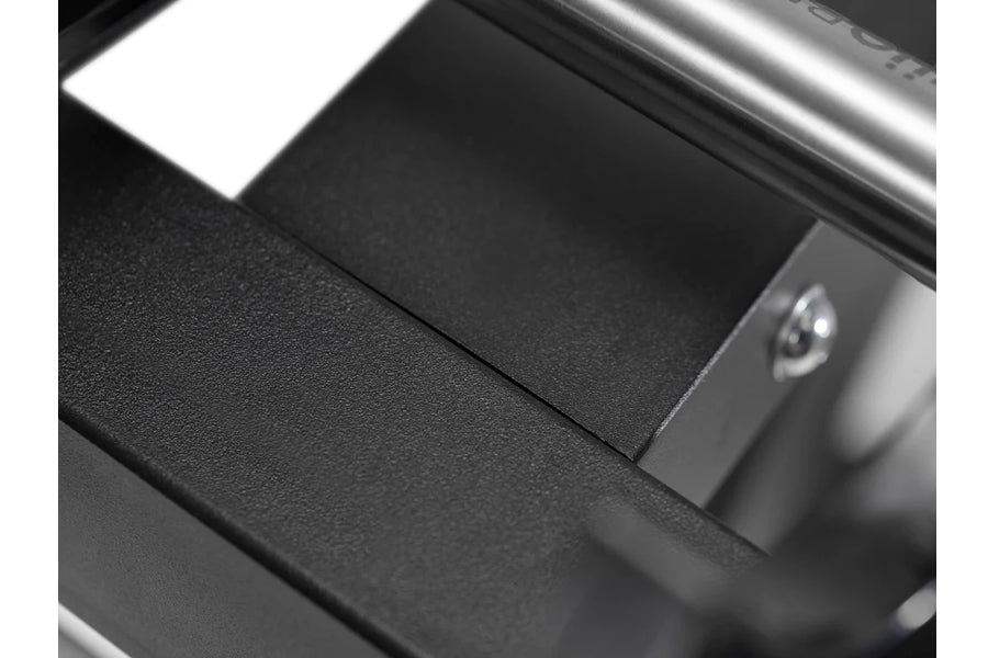Black adjustable dumbbell stand with single leg support, shown from angled overhead view on white background