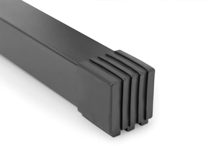 Nüobell adjustable dumbbell stand in black with single-legged design and slot openings, shown on white background