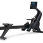 Black NordicTrack RW600 rowing machine with digital display screen and foot pedals, shown on white background