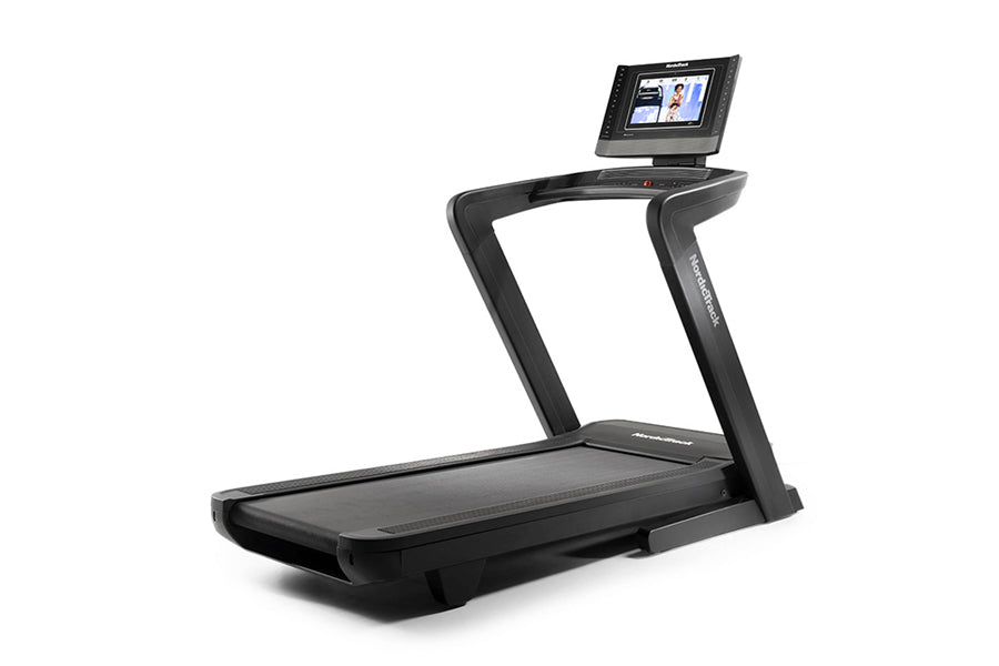 Black NordicTrack 1750 commercial treadmill with wide running deck, curved handrails, and digital touchscreen display on whit