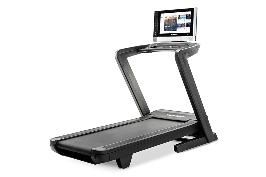 NordicTrack 2450 commercial treadmill with black frame, running deck, and touchscreen display console on white background