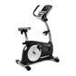 NordicTrack VU19 upright exercise bike with black and silver frame, white wheel, digital console, and black seat on white bac