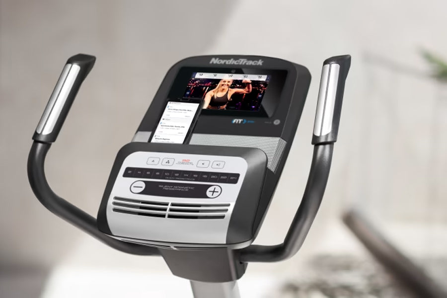 NordicTrack Commercial VU 19 upright exercise bike with black and silver console, touchscreen display, and dual handles again