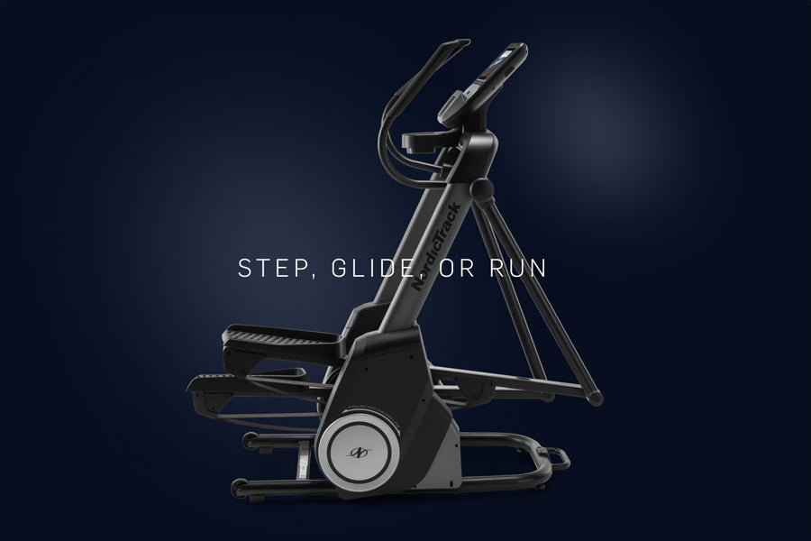 NordicTrack FS10i black elliptical machine with dual handlebars and footpedals on dark blue background