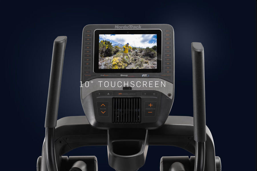 NordicTrack FS10i elliptical with 10-inch touchscreen displaying landscape scenery, gray frame with black console and control