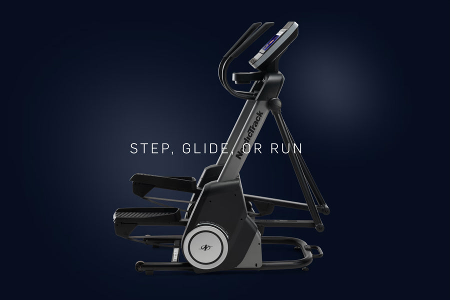 NordicTrack FS14i elliptical machine with black frame, dual foot pedals, and digital display console on dark background