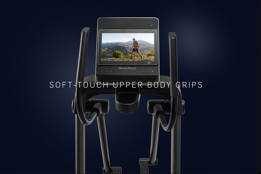 NordicTrack FS14i elliptical with black soft-touch upper body grips and touchscreen display showing mountain landscape workou