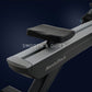 NordicTrack RW700 rowing machine with black and silver frame, padded seat, and digital console on dark blue background