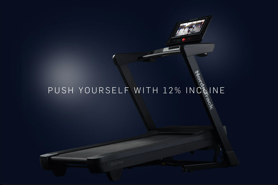Black NordicTrack EXP 14i treadmill with 12% incline capability, touchscreen display, and dark blue background