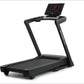 Black NordicTrack EXP 7i treadmill with digital console display and cushioned running deck on white background