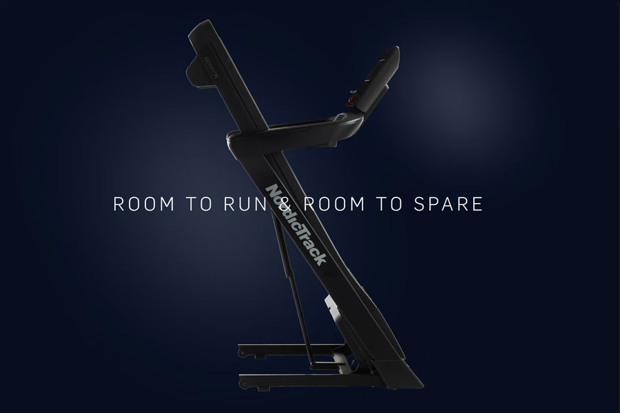 Black NordicTrack EXP 7i treadmill with incline capability against dark blue background