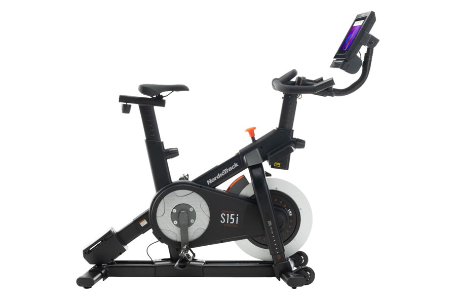 Black NordicTrack S15i indoor exercise bike with tablet holder and white flywheel on white background
