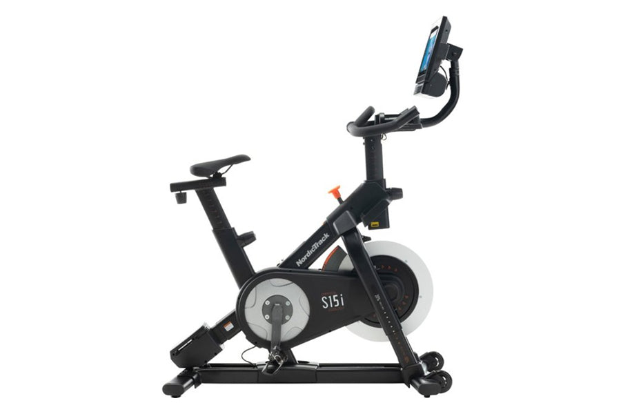 NordicTrack S15i stationary exercise bike with black frame, tablet holder with blue screen, flywheel display, and adjustable 