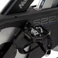 Black stationary studio exercise bike with gray seat, S22i model text, metal pedals with straps, and upright frame on white b