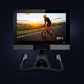 NordicTrack S27i stationary bike with black frame and handlebars, mounted display screen showing cyclist on road at sunset