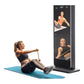 Woman performing seated rowing exercise on blue mat with NordicTrack Vault black mirror displaying workout videos on screen