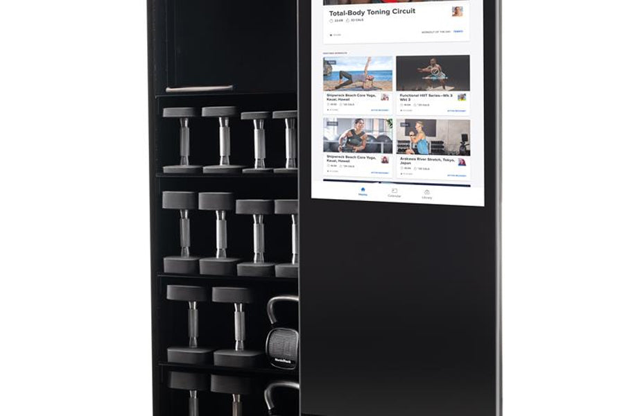 Black home gym mirror with dumbbell storage rack and digital display showing fitness workout content