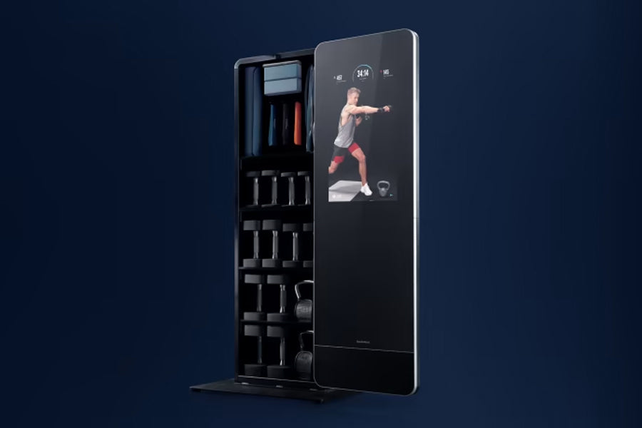NordicTrack Vault black home gym mirror with interactive touchscreen displaying workout video, left side storage compartment 
