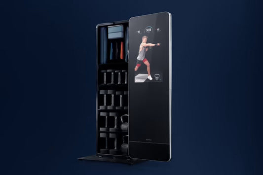 NordicTrack Vault black home gym mirror with interactive touchscreen displaying workout video, left side storage compartment 