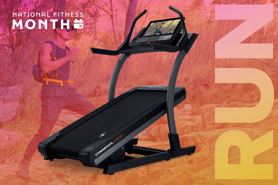 Black NordicTrack X22i commercial treadmill with curved running deck, digital console display, and curved handrails on gradie