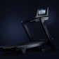 NordicTrack 1750 Commercial treadmill with black frame, wide running deck, and integrated touchscreen display showing scenic 