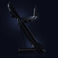 Black commercial treadmill with incline capability and digital console, shown at angle on dark blue background