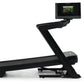 Black NordicTrack treadmill with Z-shaped frame and attached display screen showing workout video, on white background