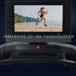 NordicTrack 2450 commercial treadmill with 22-inch HD touchscreen displaying beach running scene, black frame with control pa