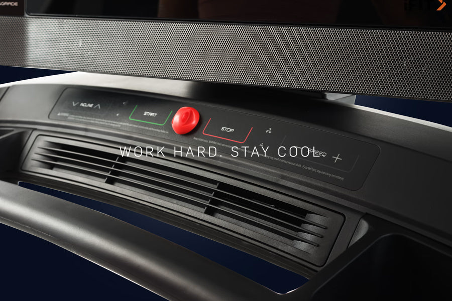 NordicTrack 2450 commercial treadmill console with red start button, black control panel, and "Work Hard Stay Cool" messaging