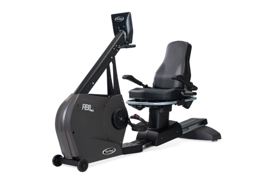 Black recumbent exercise bike with padded seat, digital display console, and foot pedals on white background