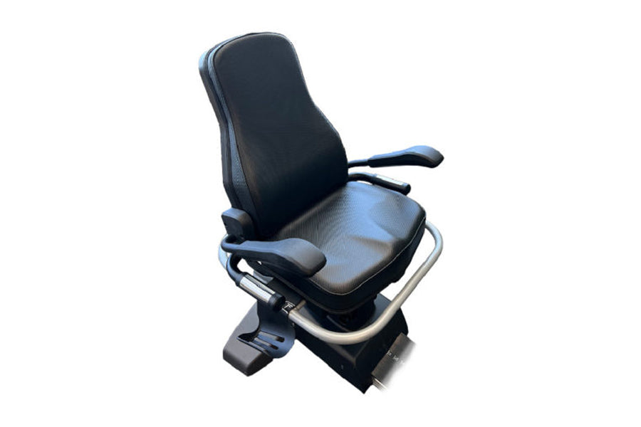 Black and gray recumbent exercise bike with padded seat and backrest, armrests, and foot pedals on white background