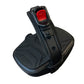 Black recumbent exercise bike foot pedal with red button and textured grip pad on white background