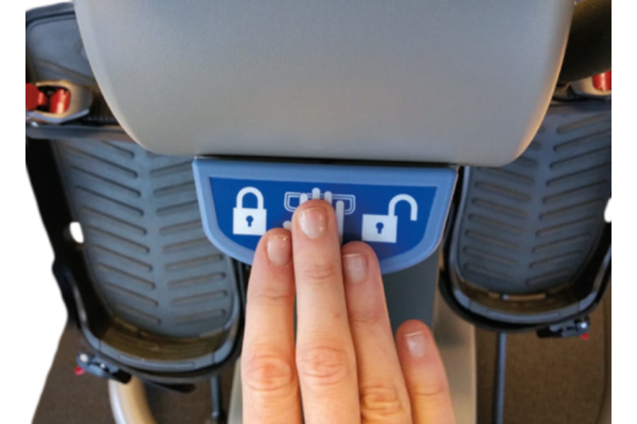Hand touching blue touchscreen panel with lock and program icons on NuStep T5XR recumbent elliptical stepper