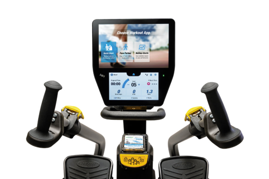 NuStep T6MAX recumbent elliptical stepper with touchscreen display showing workout app selection, dual handles with yellow ac