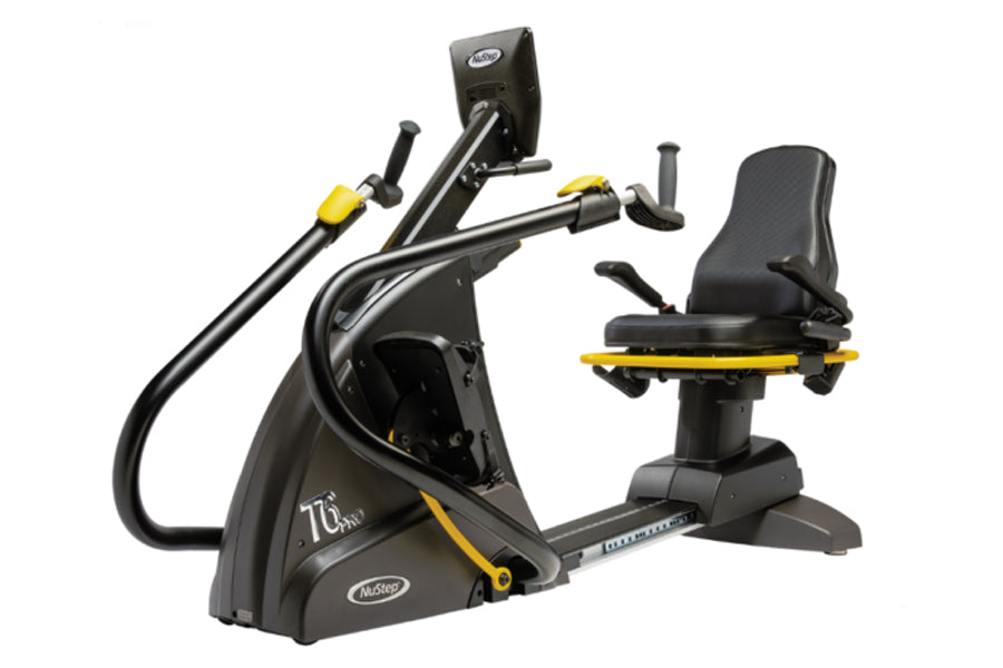 Black and yellow NuStep T6PRO recumbent elliptical stepper with padded seat, handlebars, and digital display on white backgro