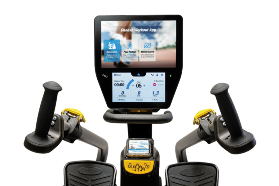 NuStep T6PRO recumbent elliptical stepper with dual handles, footpedals, and digital display showing workout app options on s