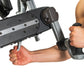 Person using black and gray upper body ergometer with handlebar grips, demonstrating rowing motion on white background