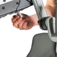 Person's hand gripping the handle of a gray and silver upper body exercise machine against white background
