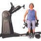 Woman using NuStep UE8PRO upper body ergometer with gray and black frame, demonstrating seated exercise motion on white backg