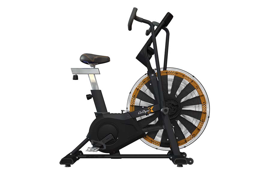 Black and gold stationary exercise bike with large fan wheel, padded seat, and drop handlebars on white background