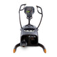 Black and gray lateral trainer with digital console, dual handlebars, and orange foot pedals, front view on white background