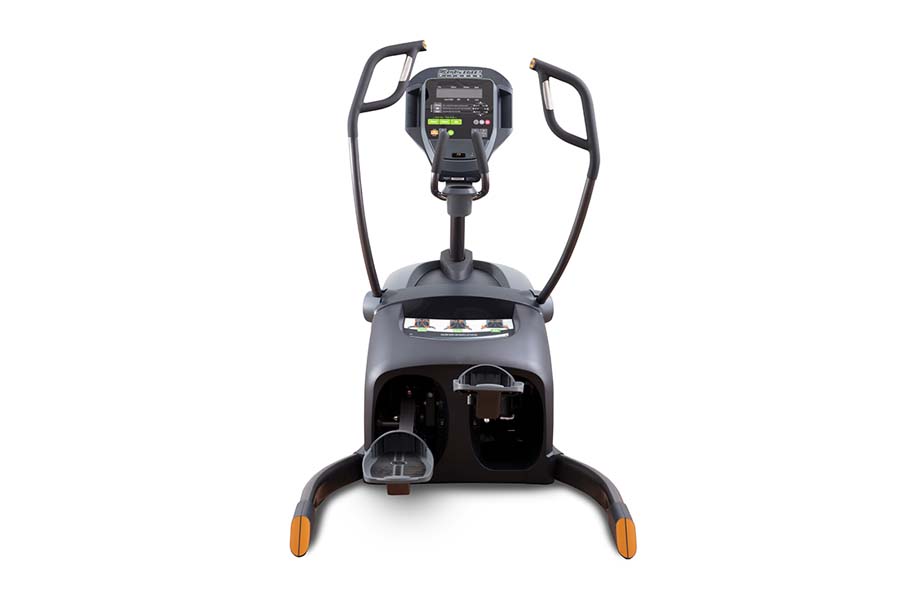 Black and gray lateral trainer with digital console, dual handlebars, and orange foot pedals, front view on white background